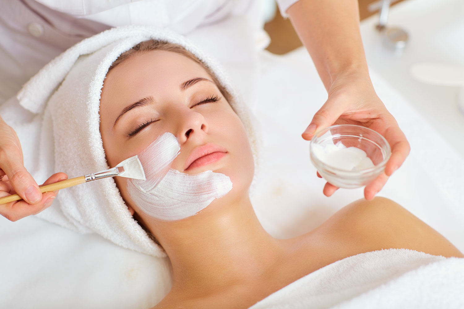 Blonde woman having a spa facial at Sunflower Spa