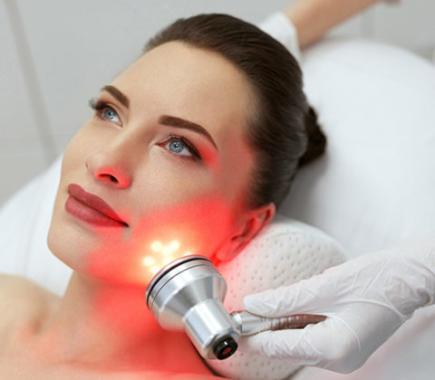 Woman having a led light therapy at Sunflower Spa