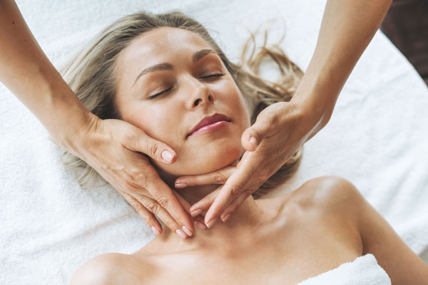 Blonde woman having a facial spa at Sunflower Spa