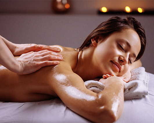 Woman receiving a relaxing massage at Sunflower Spa in Longmont, CO