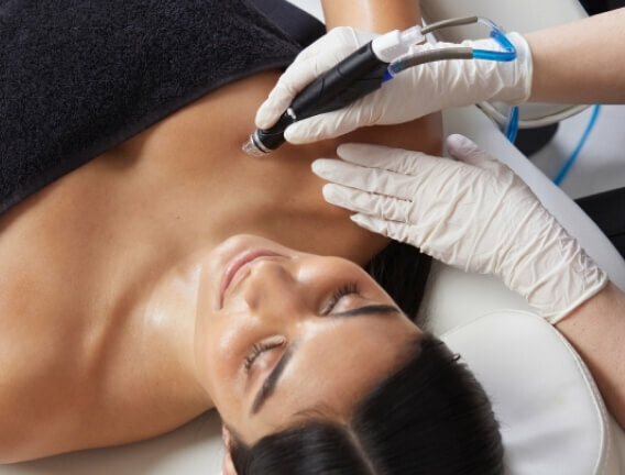 Woman getting an hydrabody treatment at Sunflower Spa